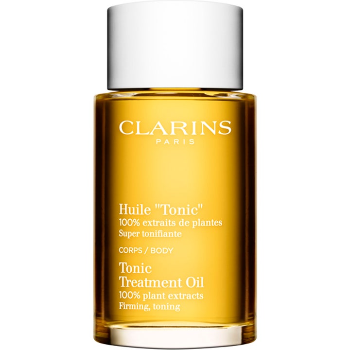 Clarins Tonic Treatment Oil kiinteyttävä vartaloöljy kultaisessa lasipullossa jossa on valkoinen korkki.