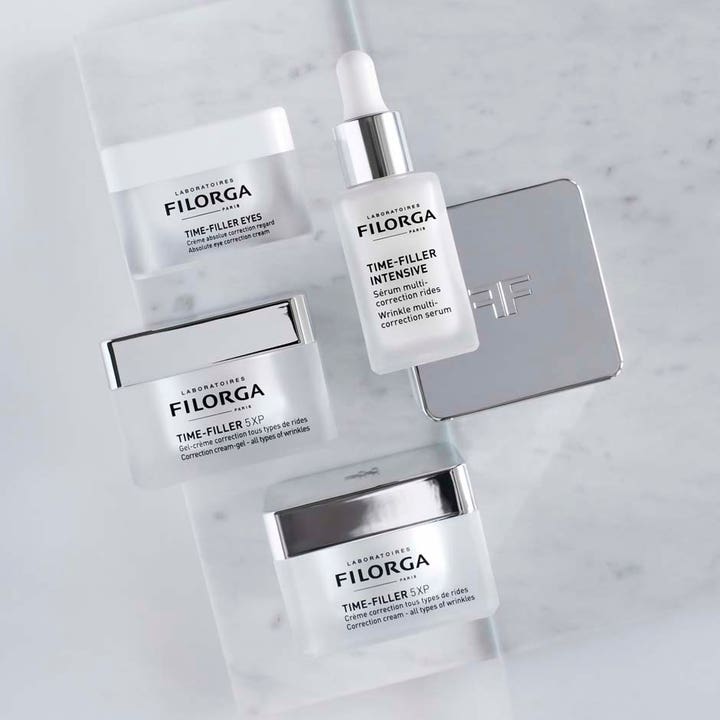 Filorga Time-Filler 5XP Cream 50 ml silottava päivävoide ja seerumi tyylikkäissä hopeakantisissa purkeissa.