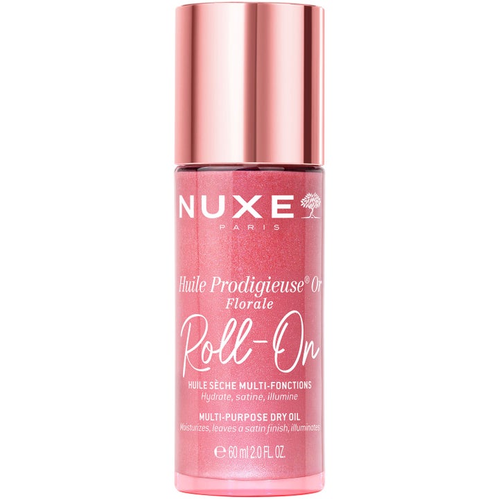 Nuxe Huile Prodigieuse Or Florale 60 ml heleyttävä kuivaöljy roll-on-pullossa on kimalteleva ja vaaleanpunainen.