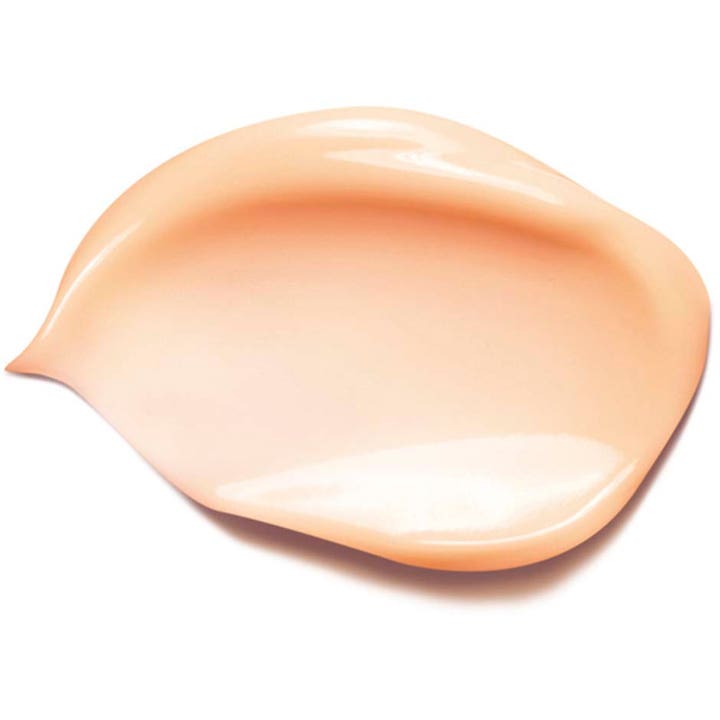 Clarins Beauty Flash Balm 50 ml heleyttävä kasvovoide, jossa on sileä ja kermainen persikan sävyinen tekstuuri.