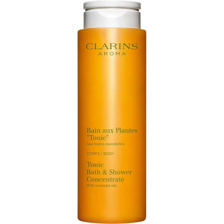 Clarins Tonic Bath & Shower Concentrate 200 ml virkistävä suihkugeeli oranssissa muovipullossa valkoisella korkilla