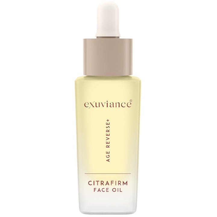 Exuviance Age Reverse+ CitraFirm Face Oil 30 ml kiinteyttävä kasvoöljy vaaleankeltaisessa huurteisessa lasipullossa.