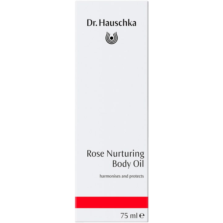 Dr. Hauschka Rose Nurturing Body Oil 75 ml hoitava vartaloöljy valkoisessa pakkauksessa punaisella raidalla.
