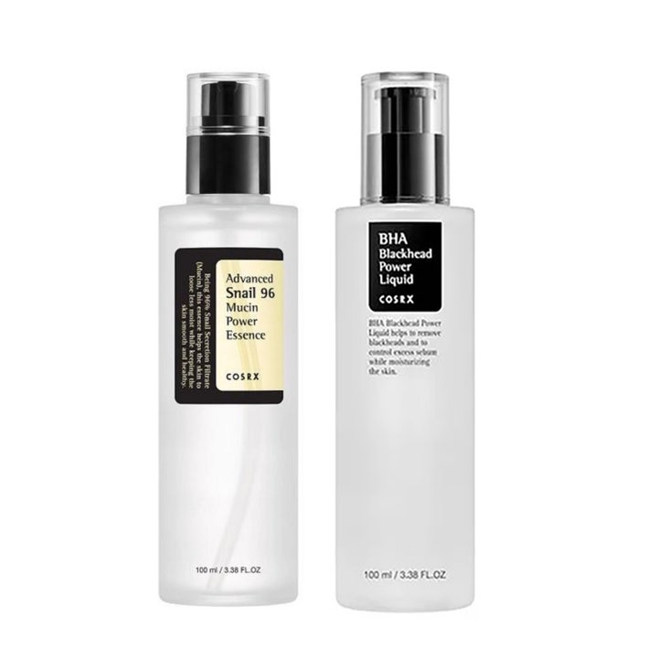 COSRX Advanced Snail 96 Mucin ja BHA Blackhead Power Liquid 100 ml hoitonesteet kahdessa huurteisessa pumppupullossa.