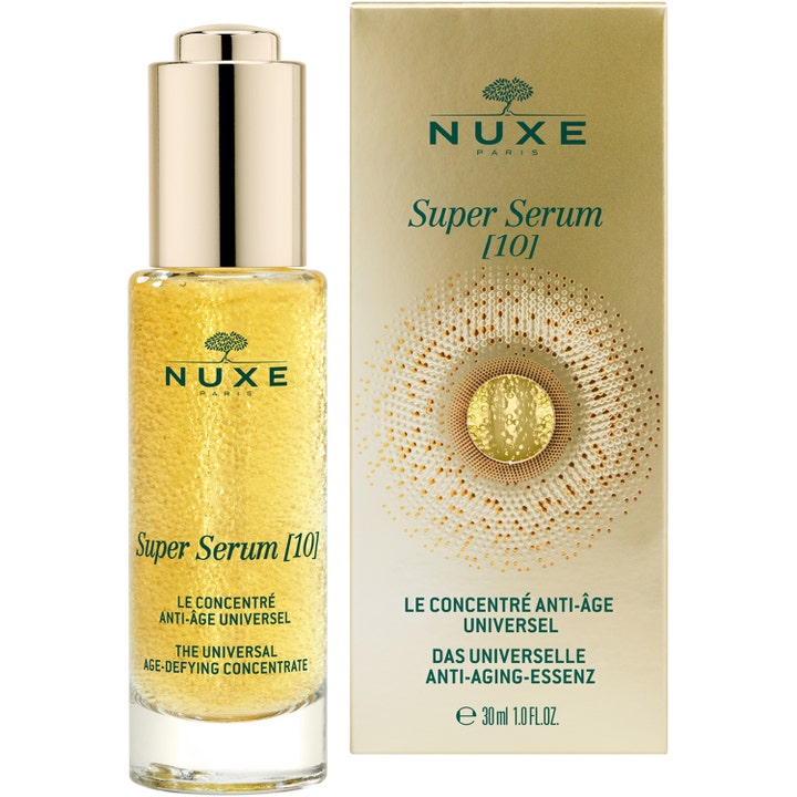 Nuxe Super Serum 30 ml ikääntymistä torjuva seerumi lasipullossa jossa on kultaisia öljyhelmiä