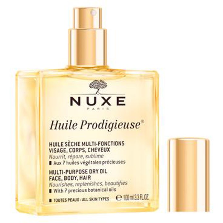 Nuxe Huile Prodigieuse 100 ml ravitseva kuivaöljy kasvoille ja vartalolle neliönmuotoisessa kultaisessa lasipullossa.