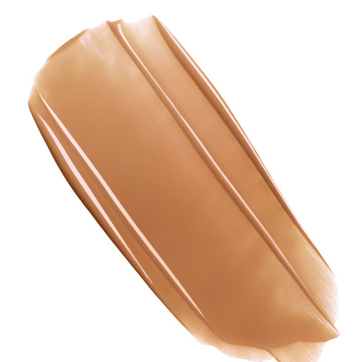 Clarins Milky Boost Capsules 06 7,8 ml heleyttävä meikkiseerumi, jossa on voidemainen ruskea koostumus.