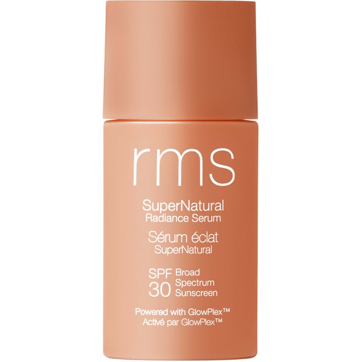 RMS SuperNatural Radiance Serum SPF 30 heleyttävä aurinkosuojaseerumi persikanvärisessä mattapintaisessa pullossa