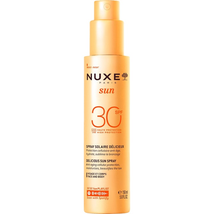 Nuxe Sun Delicious Sun Spray SPF 30 150 ml suojaava ja kosteuttava aurinkosuihke oranssissa pumppupullossa.