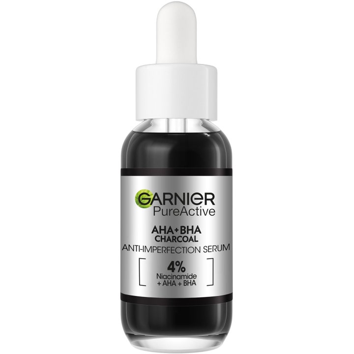 Garnier PureActive AHA+BHA Charcoal epäpuhtauksia vähentävä seerumi mustassa lasipullossa valkoisella pipetillä.
