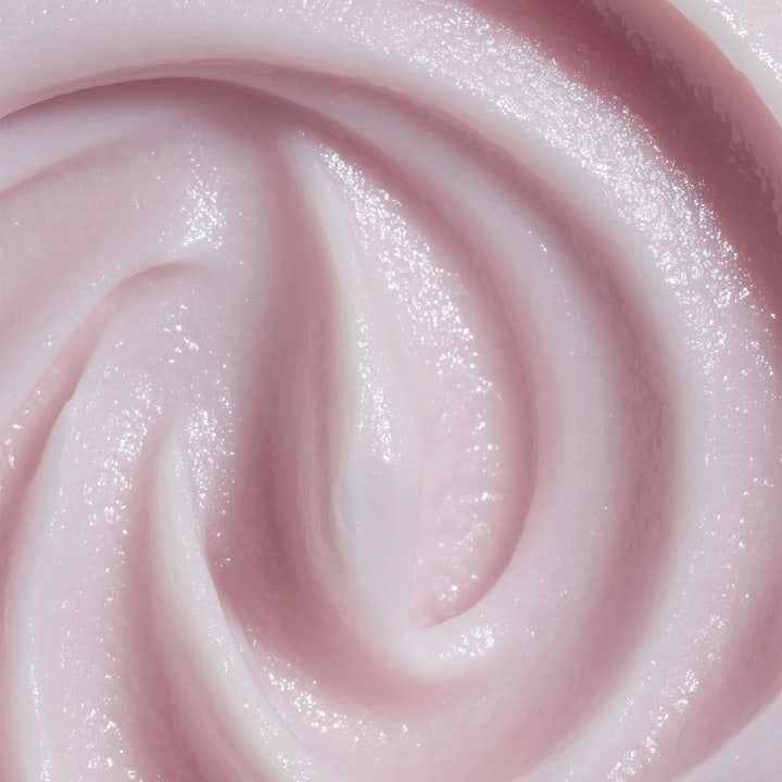 MANTLE The Miracle Mask 75 ml heleyttävä kasvonaamio, jossa on kermainen vaaleanpunainen ja hohtava koostumus.