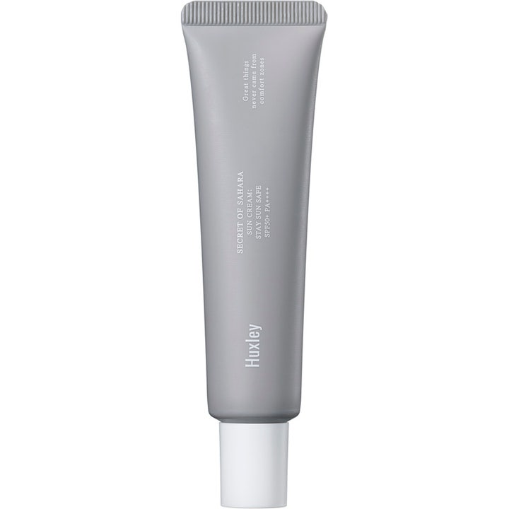 Huxley Secret of Sahara Sun Cream Stay Sun Safe SPF50+ suojaava aurinkovoide harmaassa tuubissa valkoisella korkilla