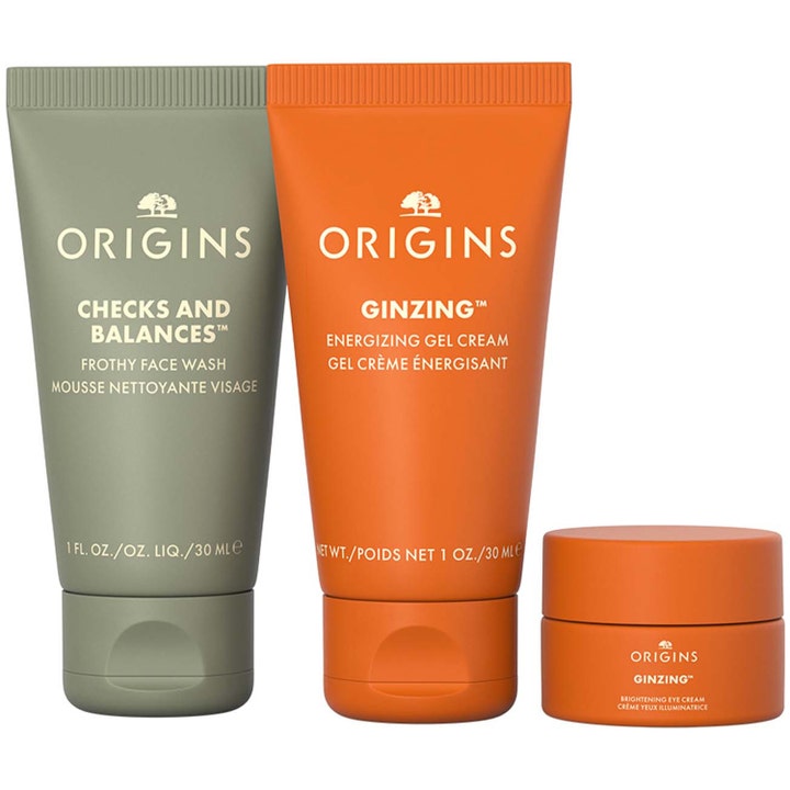 Origins Mini Travel Essentials Trio virkistävä setti sisältää vihreän puhdistusvaahdon ja kaksi oranssia voidetta.