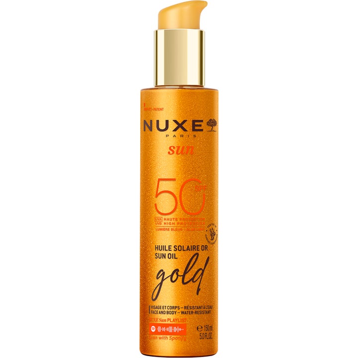 Nuxe Sun Oil Gold 150 ml korkean suojan antava aurinkoöljy SPF 50 kimaltelevassa oranssissa pumppupullossa.