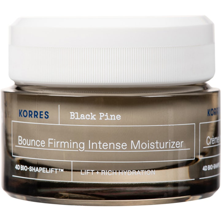 Korres Black Pine Bounce Firming Intense Moisturizer kiinteyttävä ja kohottava kasvovoide tummassa lasipurkissa.