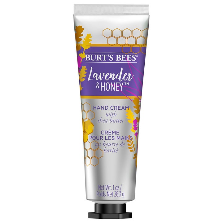 Burt's Bees Lavender & Honey Hand Cream 28,3 g hoitava käsivoide hopeisessa tuubissa, jossa on liloja ja keltaisia kuvioita.