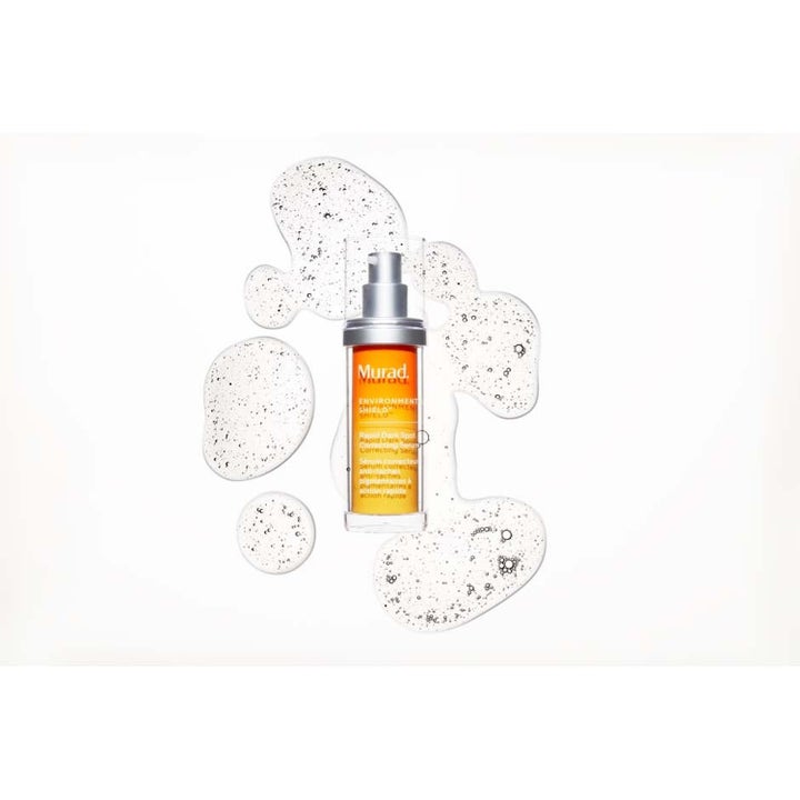 Murad Spot Corrector 80 ml pigmenttiläiskiä häivyttävä seerumi oranssissa pullossa kirkkaiden pisaroiden keskellä