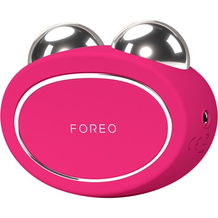 FOREO BEAR 2 Fuchsia 1 kpl mikrovirtalaite kiinteyttää ihoa ja siinä on fuksianpunainen silikonipinta ja hopeiset pallot
